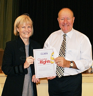 Guardian Pam Simmons and CLASS General Manager Graeme Kirkin sign the Charter of Rights certificate at CLASS's 30th birthday celebration  on March 12.
